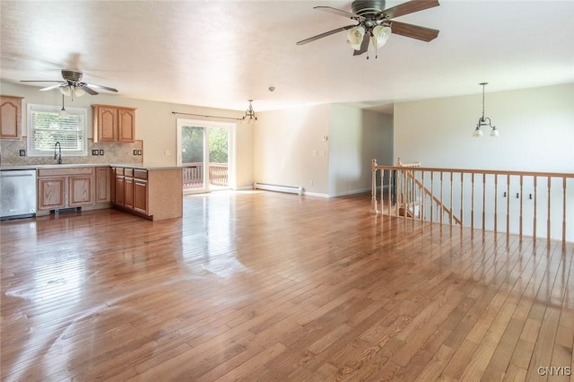 25386 Stewart Dr, Champion, NY 13619 - kitchen with dishwasher, a baseboard radiator, ceiling fan, and hardwood / wood-style floors