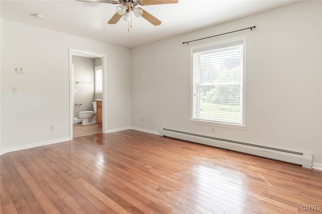 25386 Stewart Dr, Champion, NY 13619 - spare room with a baseboard heating unit, baseboard heating, healthy amount of natural light, and light wood-style flooring