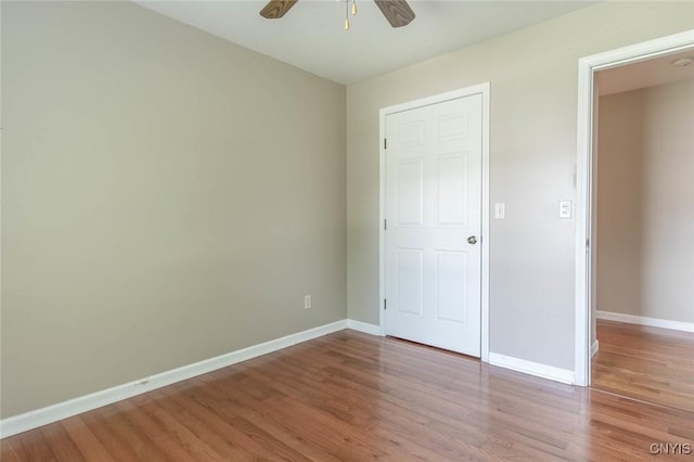 25386 Stewart Dr, Champion, NY 13619 - unfurnished bedroom featuring baseboards, wood finished floors, and ceiling fan