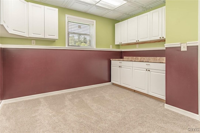 25386 Stewart Dr, Champion, NY 13619 - laundry area featuring light colored carpet and baseboards