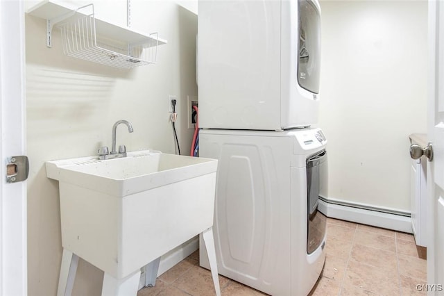 25386 Stewart Dr, Champion, NY 13619 - laundry room with stacked washing machine and dryer and a baseboard radiator