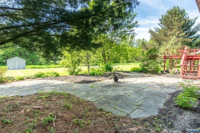 25386 Stewart Dr, Champion, NY 13619 - view of green lawn featuring a patio, stairs, and a wooden deck
