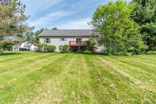 25386 Stewart Dr, Champion, NY 13619 - rear view of house with a wooden deck and a yard