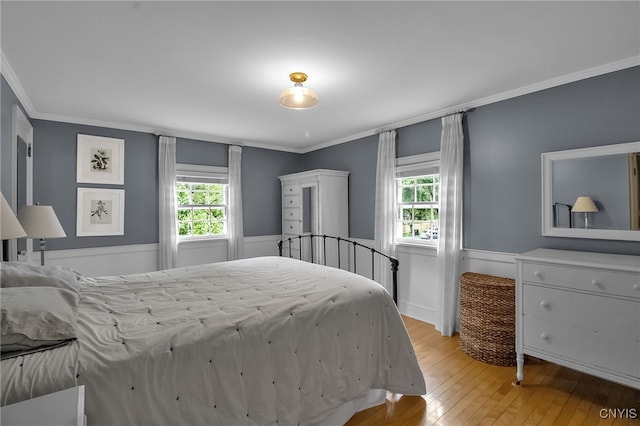 11 S Meadow Dr, Orchard Park, NY 14127 - bedroom with crown molding, light wood finished floors, and multiple windows