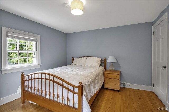 11 S Meadow Dr, Orchard Park, NY 14127 - bedroom with hardwood / wood-style floors and baseboards
