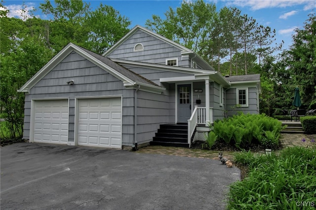 11 S Meadow Dr, Orchard Park, NY 14127 - view of front of house featuring a garage and asphalt driveway