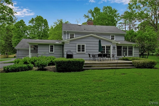 11 S Meadow Dr, Orchard Park, NY 14127 - back of property with a chimney, a lawn, and a deck