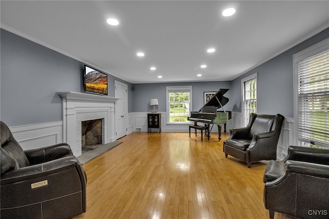 11 S Meadow Dr, Orchard Park, NY 14127 - living area with crown molding, a fireplace, light wood-style flooring, wainscoting, and recessed lighting