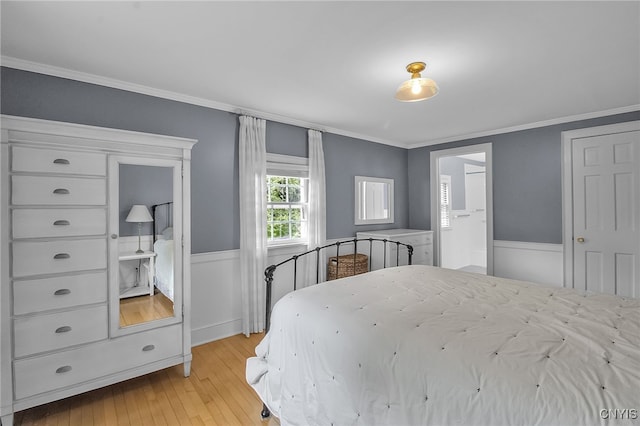 11 S Meadow Dr, Orchard Park, NY 14127 - bedroom featuring light wood-style flooring, ornamental molding, and wainscoting
