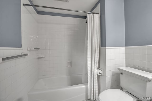 11 S Meadow Dr, Orchard Park, NY 14127 - bathroom featuring tile walls, shower / bath combo with shower curtain, and a wainscoted wall