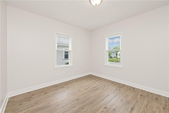 131 Pomona Dr, Greece, NY 14616 - spare room featuring healthy amount of natural light, light wood-style flooring, and baseboards