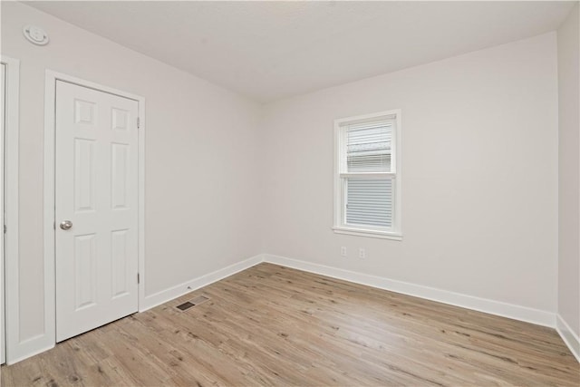 131 Pomona Dr, Greece, NY 14616 - unfurnished room featuring baseboards, light wood-style flooring, and a smoke detector
