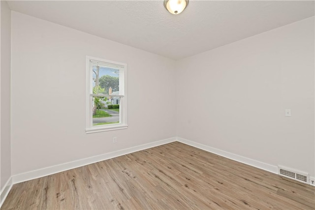 131 Pomona Dr, Greece, NY 14616 - unfurnished room featuring wood finished floors and baseboards