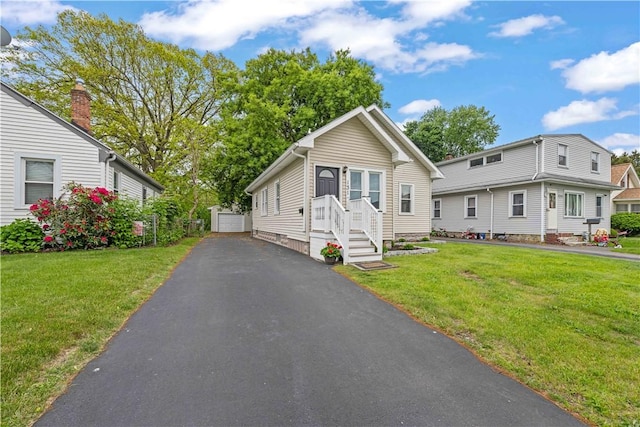 131 Pomona Dr, Greece, NY 14616 - view of front of home with an outbuilding and a front lawn