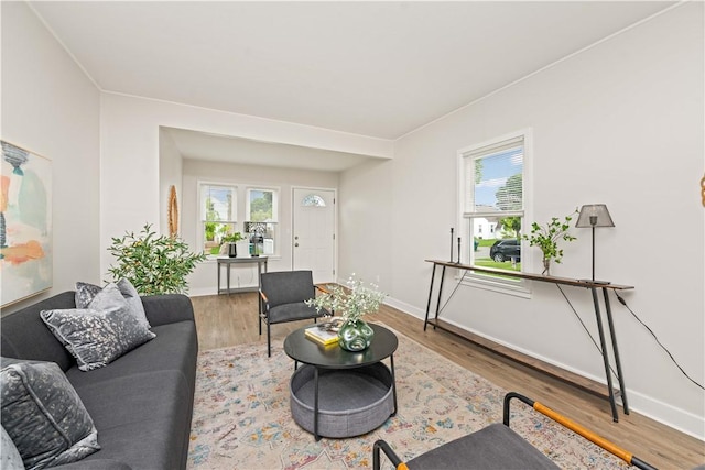 131 Pomona Dr, Greece, NY 14616 - living room featuring wood finished floors and baseboards