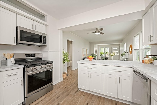 131 Pomona Dr, Greece, NY 14616 - kitchen with stainless steel appliances, light countertops, and white cabinetry