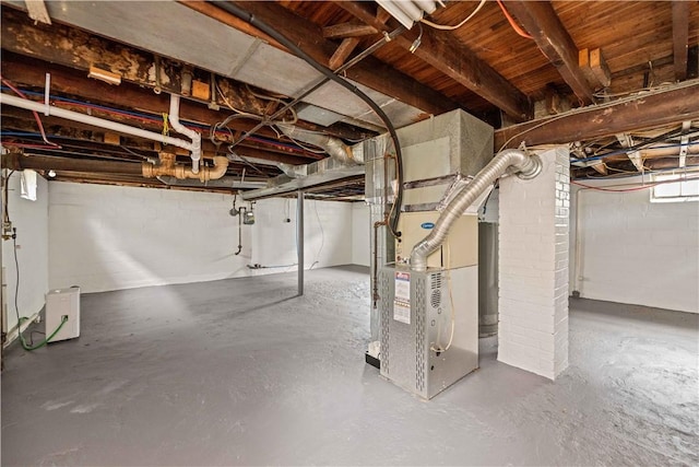 131 Pomona Dr, Greece, NY 14616 - below grade area featuring heating unit and concrete block wall