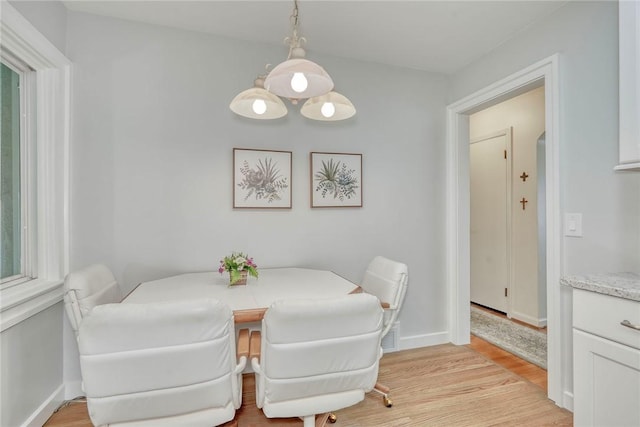 261 Hager Rd, Greece, NY 14616 - dining space with light wood-style flooring and baseboards