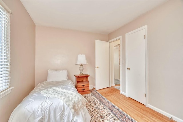 261 Hager Rd, Greece, NY 14616 - bedroom featuring light wood-type flooring and baseboards