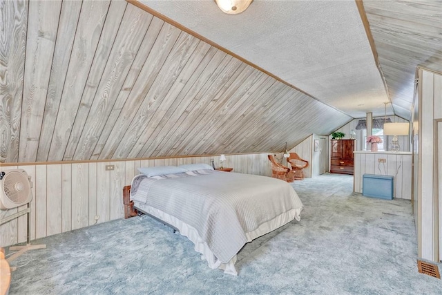261 Hager Rd, Greece, NY 14616 - bedroom featuring wood walls, vaulted ceiling, and carpet flooring