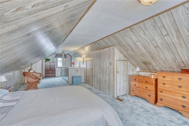 261 Hager Rd, Greece, NY 14616 - carpeted bedroom featuring wood walls and vaulted ceiling