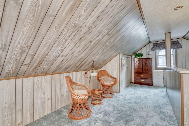 261 Hager Rd, Greece, NY 14616 - sitting room with wooden walls, vaulted ceiling, and carpet floors