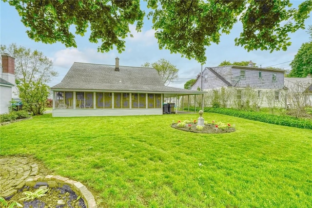 261 Hager Rd, Greece, NY 14616 - back of house with a sunroom, a lawn, and a shingled roof