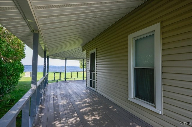 3180 Carleton Island Rd Unit 1, Cape Vincent, NY 13618 - wooden terrace featuring view of water and beach
