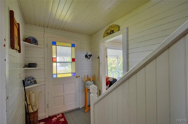 3180 Carleton Island Rd Unit 1, Cape Vincent, NY 13618 - doorway to outside featuring wood ceiling, wood finished floors, and wooden walls