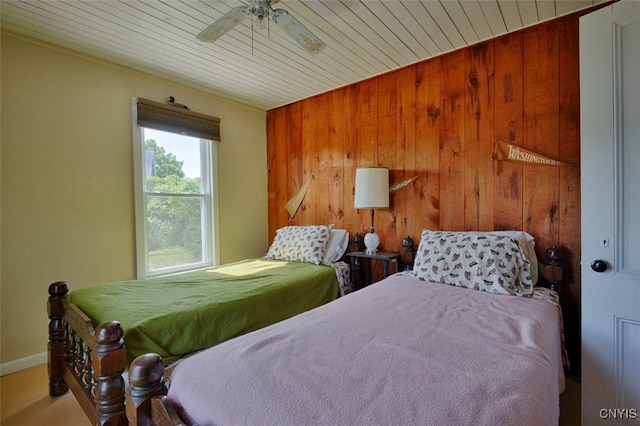 3180 Carleton Island Rd Unit 1, Cape Vincent, NY 13618 - bedroom featuring wooden walls, baseboards, wooden ceiling, and ceiling fan