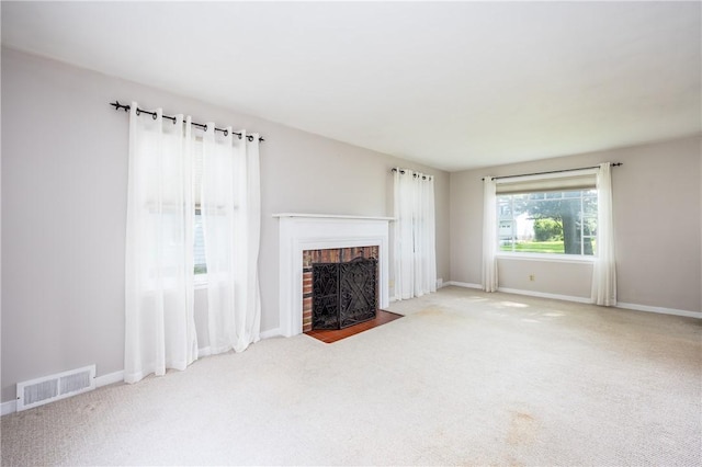 1711 N Winton Rd, Irondequoit, NY 14609 - unfurnished living room featuring carpet floors, a fireplace, and baseboards