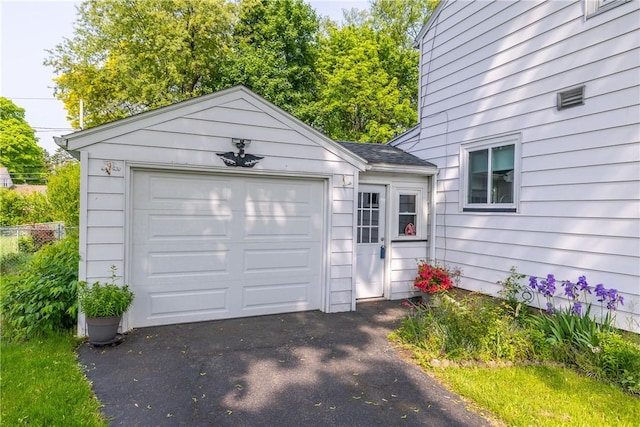 1711 N Winton Rd, Irondequoit, NY 14609 - garage with asphalt driveway
