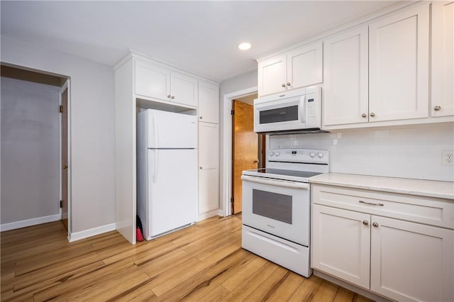 1711 N Winton Rd, Irondequoit, NY 14609 - kitchen featuring white appliances, light wood finished floors, white cabinetry, recessed lighting, and light countertops