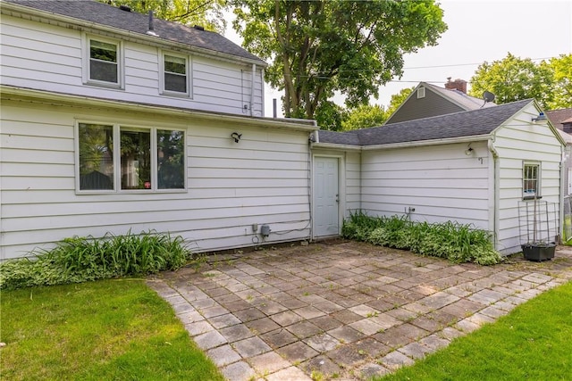 1711 N Winton Rd, Irondequoit, NY 14609 - back of property featuring a patio area and a lawn