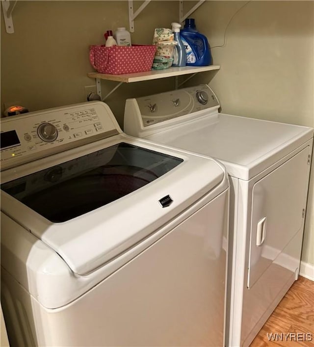 4547 Chestnut Ridge Rd Unit 104B, Amherst, NY 14228 - laundry area with washing machine and dryer and light wood-type flooring