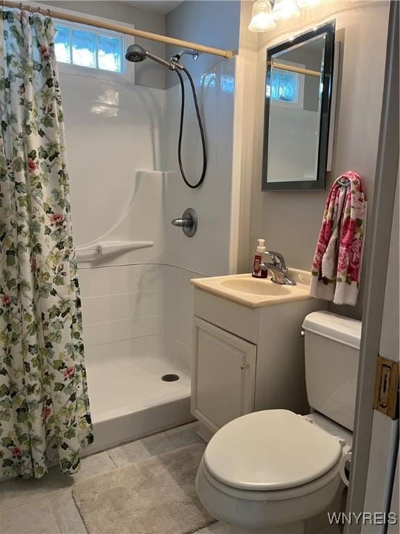 118 Erie St, Lancaster, NY 14086 - full bath featuring a shower with curtain, toilet, vanity, and tile patterned flooring