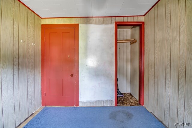 6305 E Main St, Byron, NY 14557 - unfurnished bedroom with wooden walls and carpet flooring