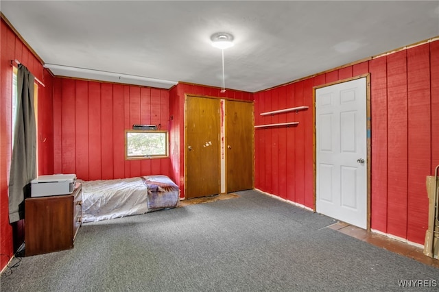 6305 E Main St, Byron, NY 14557 - bedroom with carpet floors and wood walls