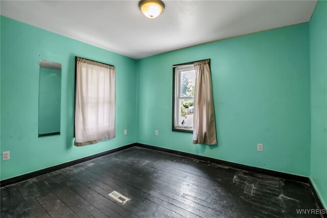 6305 E Main St, Byron, NY 14557 - unfurnished room featuring wood-type flooring and baseboards