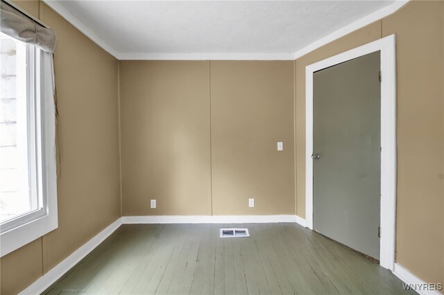 6305 E Main St, Byron, NY 14557 - empty room featuring hardwood / wood-style floors, baseboards, and ornamental molding