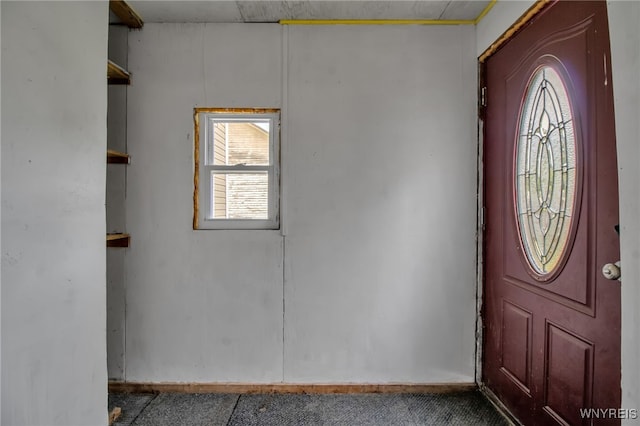 6305 E Main St, Byron, NY 14557 - foyer entrance featuring carpet and baseboards