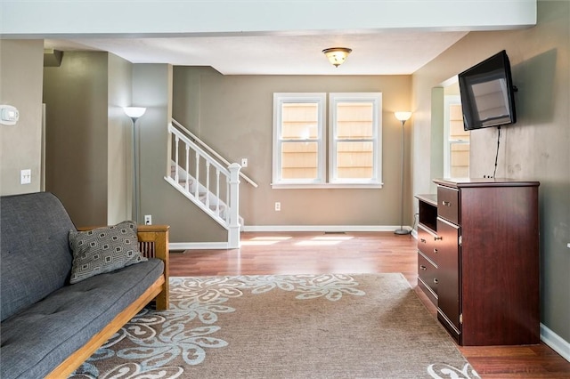 86 Leonard Rd, Greece, NY 14616 - living room featuring wood finished floors, stairs, and baseboards