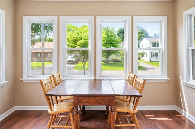 86 Leonard Rd, Greece, NY 14616 - dining room with baseboards and dark wood-style floors