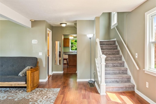 86 Leonard Rd, Greece, NY 14616 - stairway with wood finished floors, baseboards, and a ceiling fan
