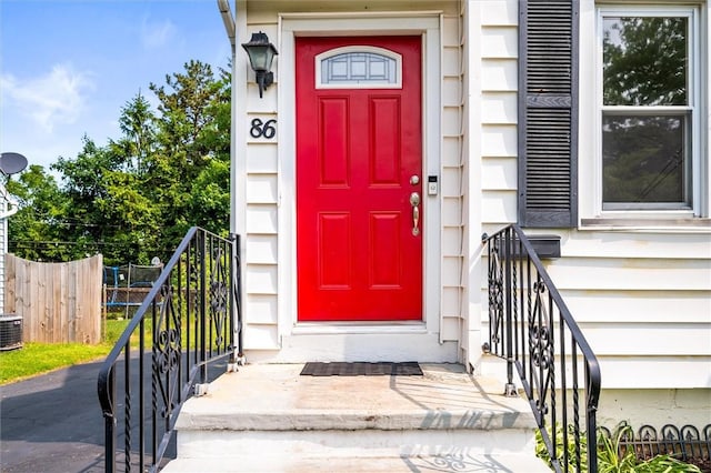 86 Leonard Rd, Greece, NY 14616 - doorway to property featuring central AC unit