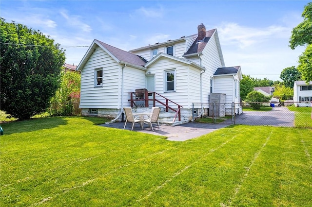 86 Leonard Rd, Greece, NY 14616 - back of house featuring a patio area, a chimney, and a gate