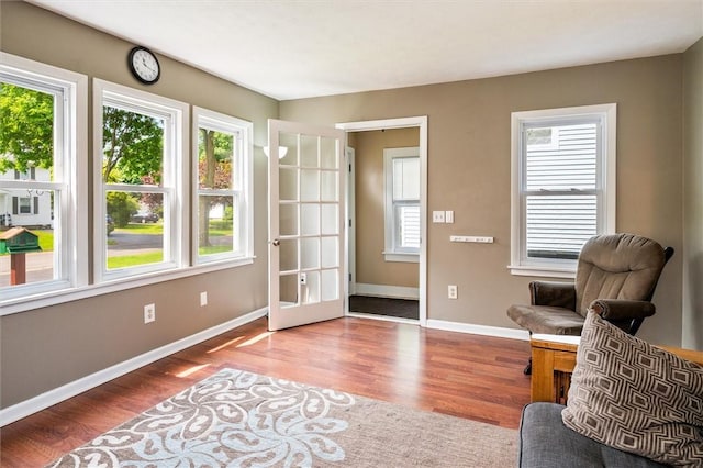 86 Leonard Rd, Greece, NY 14616 - living area with plenty of natural light, wood finished floors, and baseboards