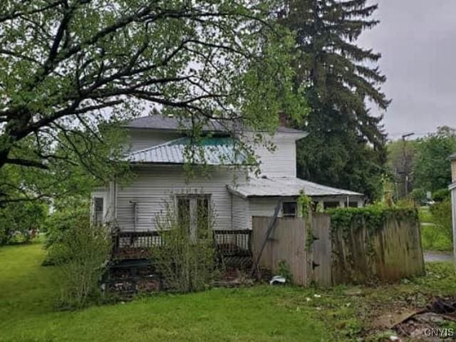 211 Vienna St, Arcadia, NY 14513 - back of property featuring a lawn and a deck