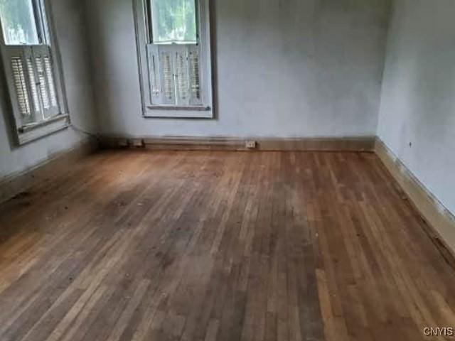 211 Vienna St, Arcadia, NY 14513 - empty room with wood finished floors and baseboards