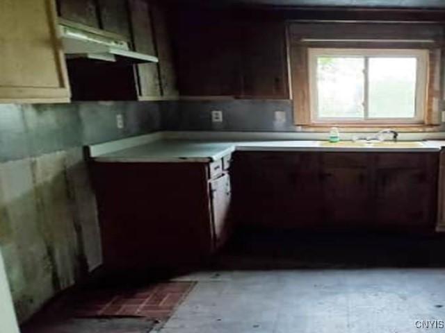 211 Vienna St, Arcadia, NY 14513 - kitchen with under cabinet range hood and light countertops